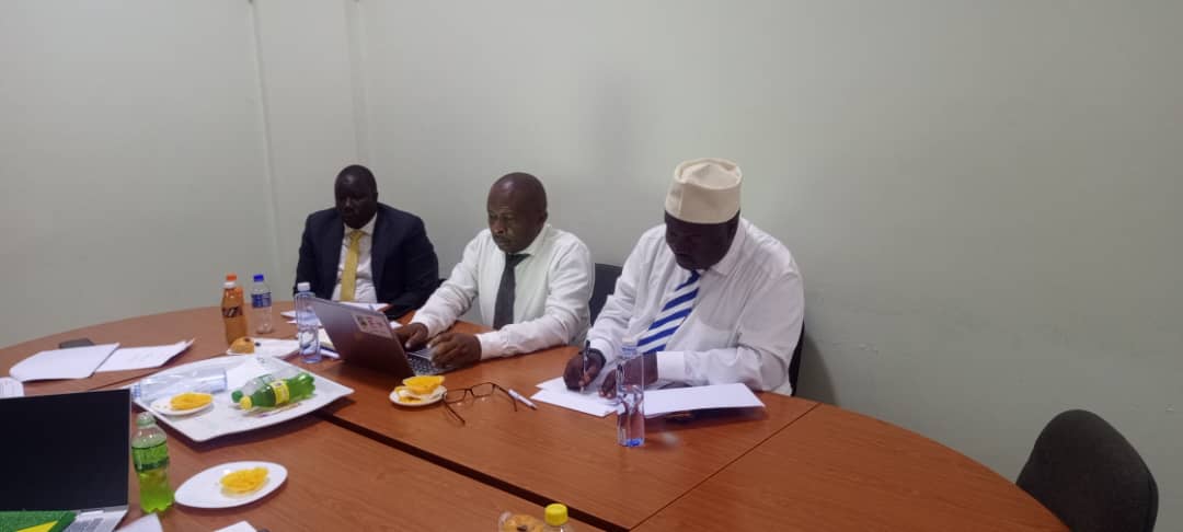 ICCIU executive committee members reviewing reports during a working session