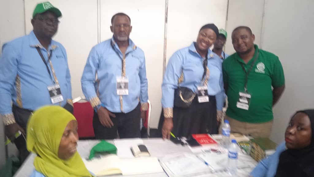 ICCIU exhibition team welcoming visitors at the chamber stand