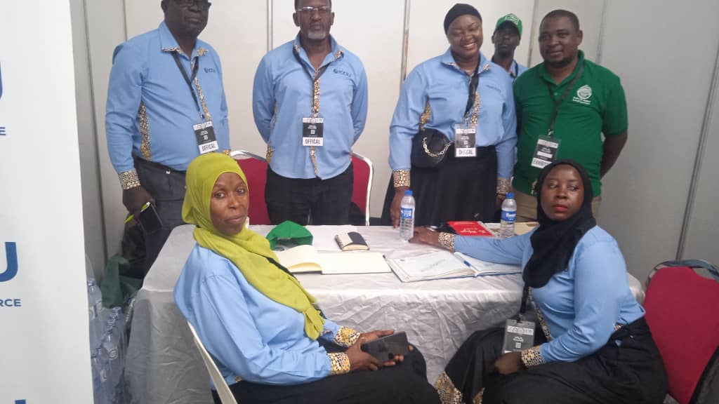 ICCIU exhibition team registering visitors at the chamber stand