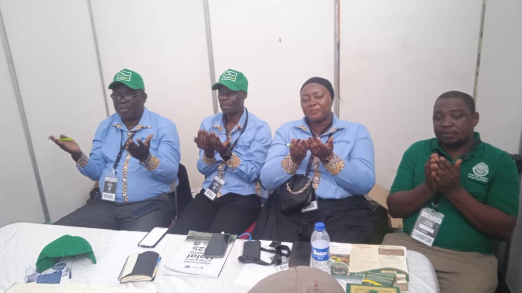 ICCIU team in prayer at the chamber's expo pavilion